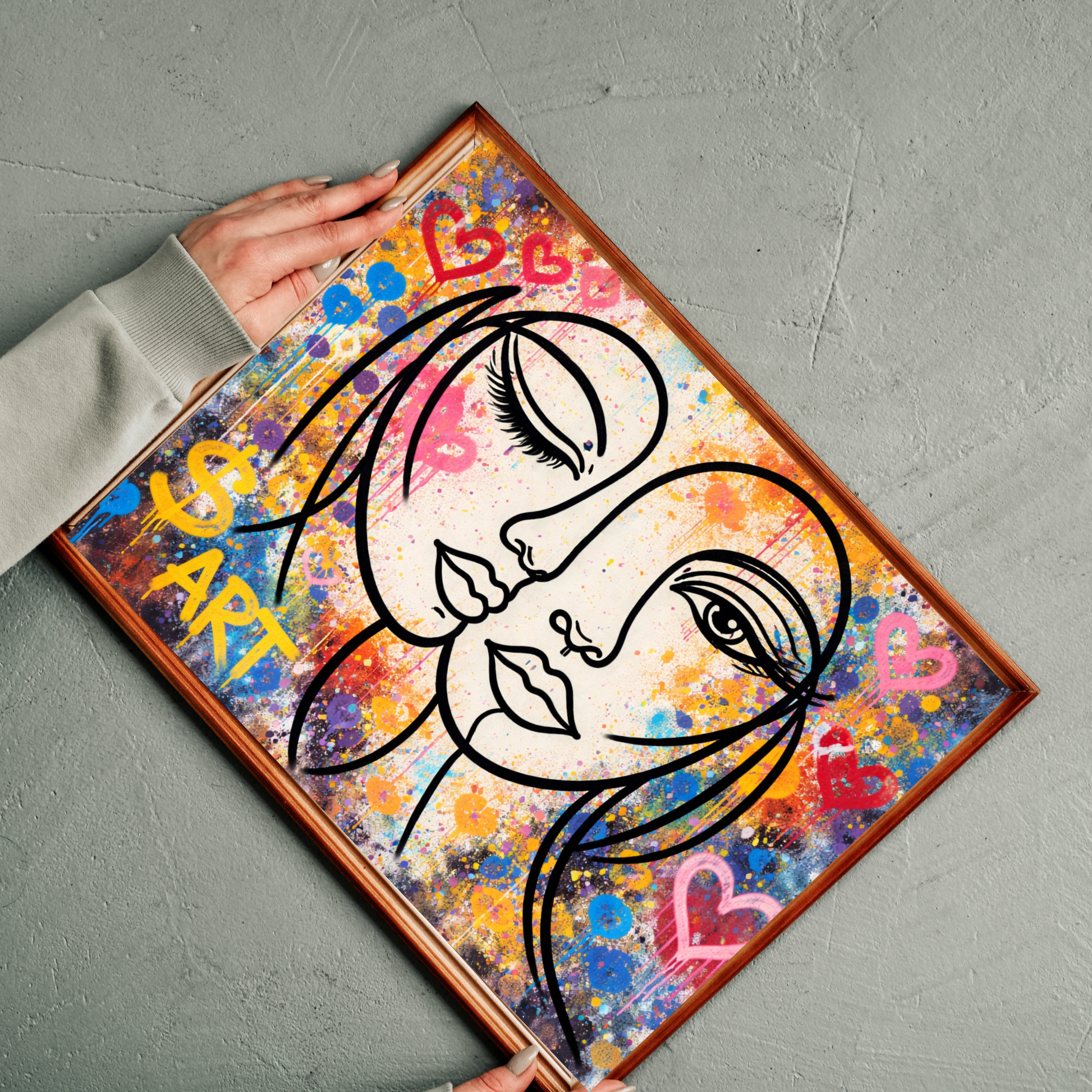 Colorful abstract art piece with artistic depiction of faces and hearts on a gray surface.